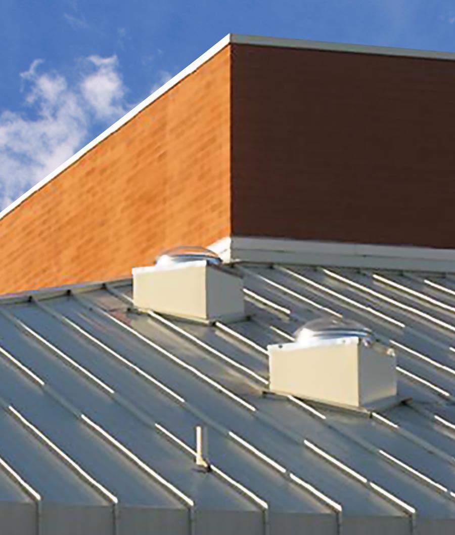 Two-Natural Light tubular skylights installed on metal roof curb mount